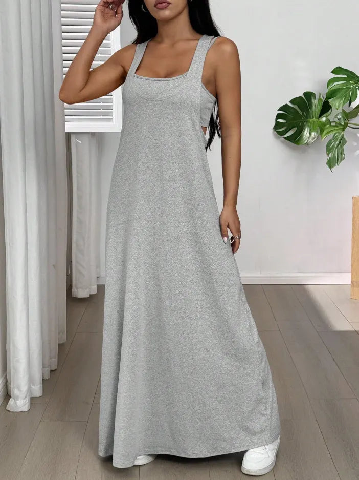 Long women's dress with a two-piece effect and side cutouts