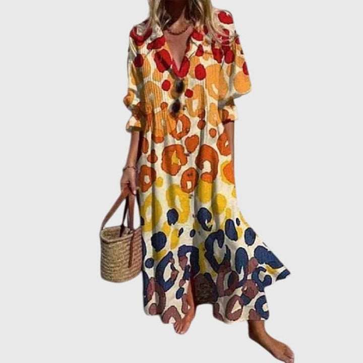 Elegant bohemian Zariah dress by Emma & Rose Cape Town featuring flowing fabric and intricate patterns.