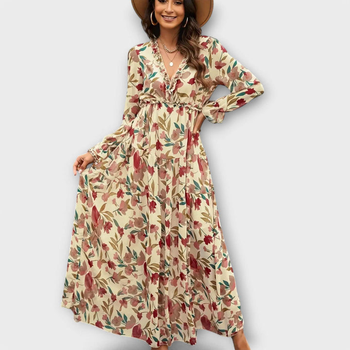 Elegant Ynah™ maxi dress by Emma & Rose Cape Town, featuring flowing fabric and stylish design, shown on a model.