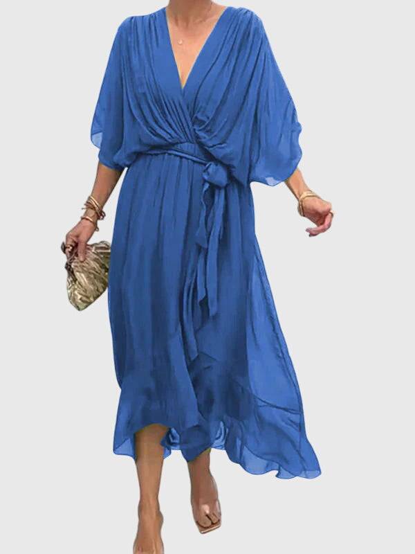 Elegant Bethany dress by Emma & Rose Cape Town, featuring a flowing fabric and stylish design, shown on a model.