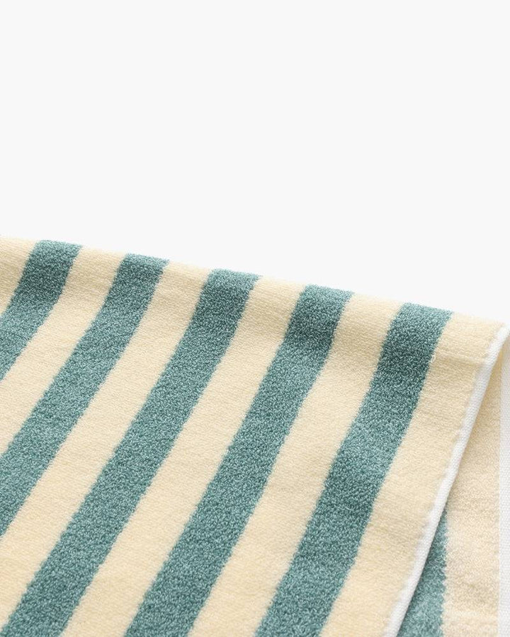 Emma & Rose Manhattan Lance™ Sea Stripe Hand Towel with blue and white nautical pattern, soft and absorbent cotton fabric.