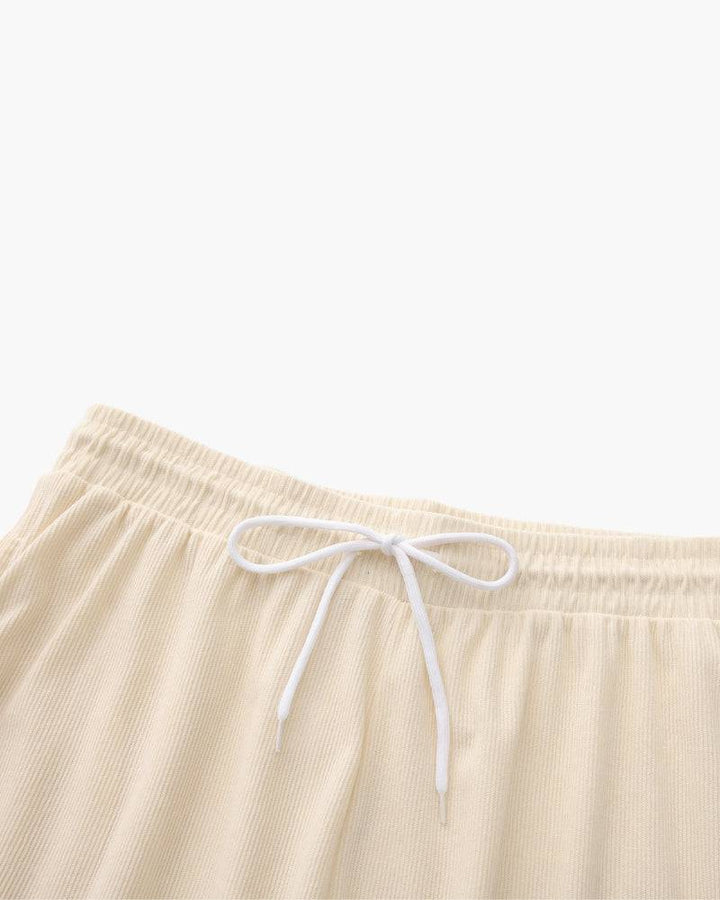 Emma & Rose Manhattan Dean™ Beachstride Shorts in lightweight fabric with a casual fit, shown in vibrant beach-inspired colors.