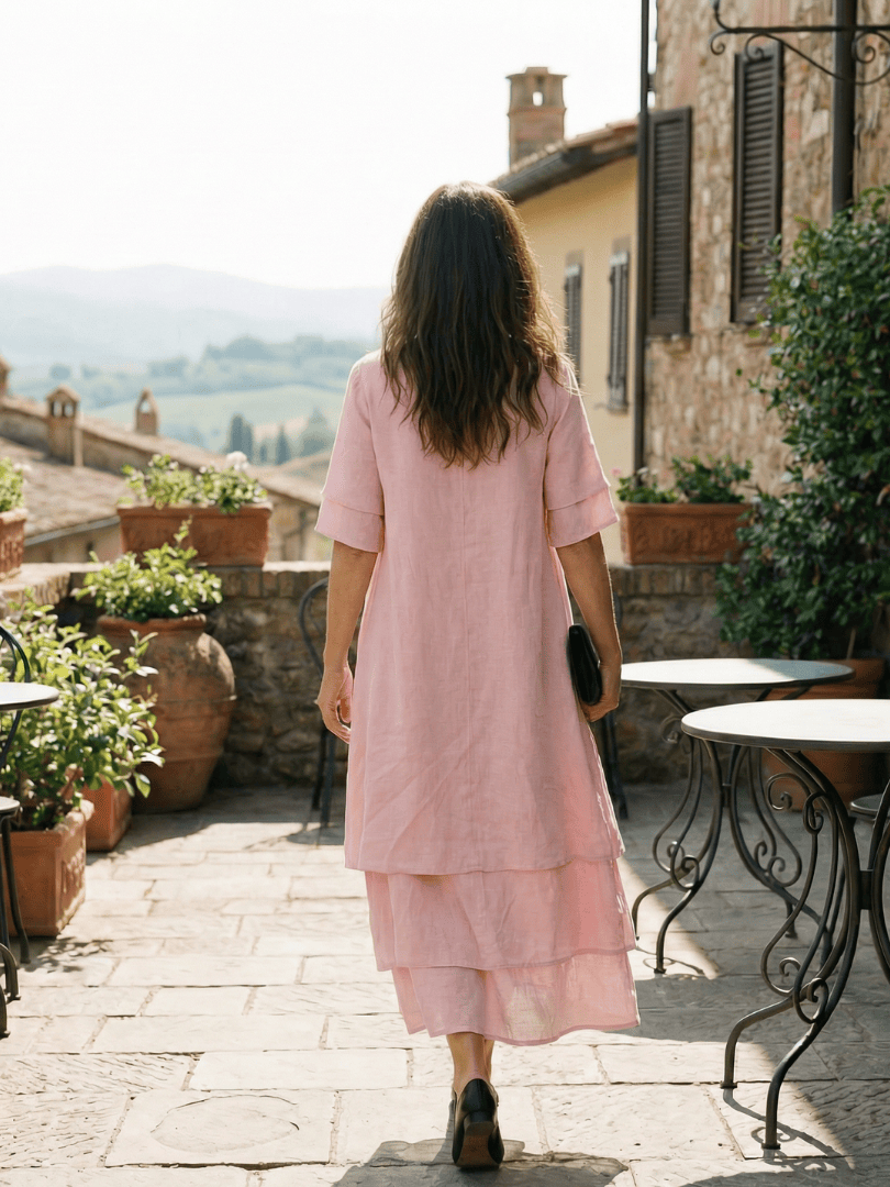 Emma & Rose Cape Town Belen™ soft layered dress with flowing fabric and elegant design, displayed on a hanger.
