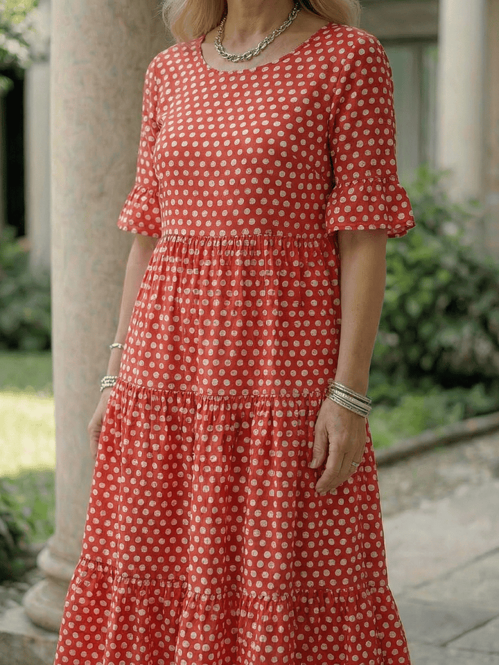 Emma & Rose Cape Town Arlo™ Dot Tiered Midi Dress featuring a flowy, tiered design with a dotted pattern and adjustable straps.
