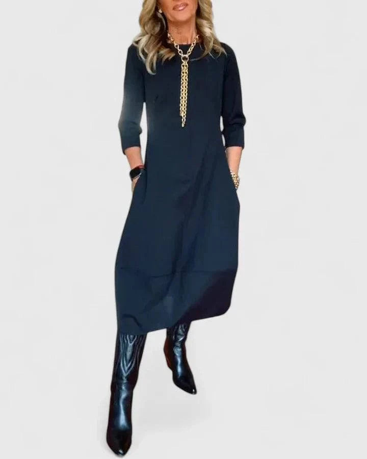 Elegant Danyshka™ midi dress by Emma & Rose Cape Town, featuring a flowing silhouette and stylish design, shown on a model.