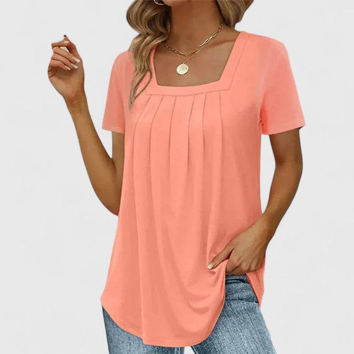 Mirelina™ summer blouse for women by Emma & Rose Cape Town, featuring lightweight fabric and elegant design, worn on a model.