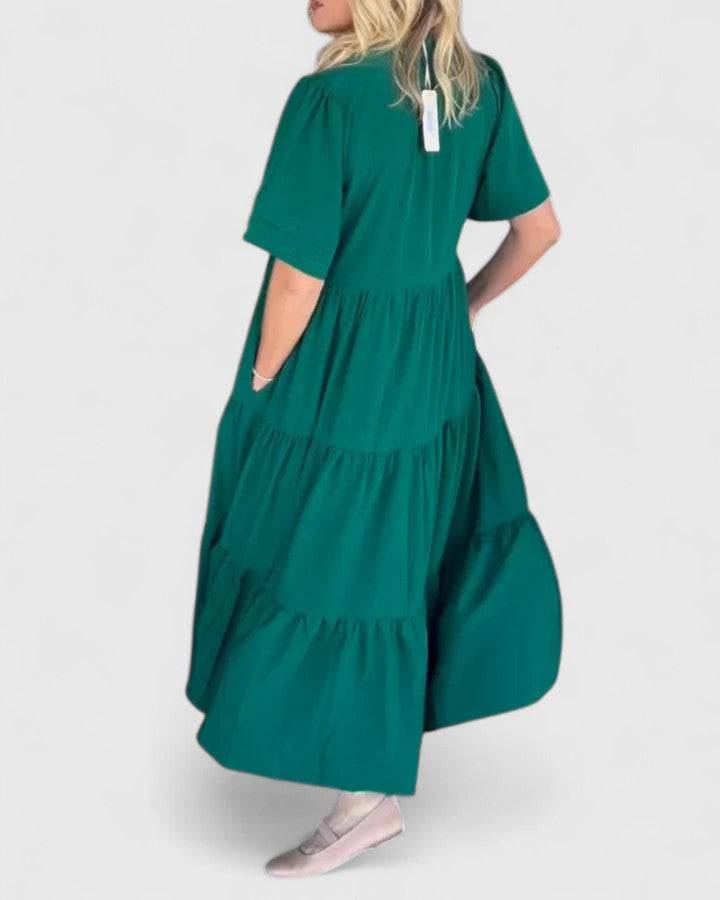 Rebecca™ Elegant Maxi Dress by Emma & Rose Cape Town, shown in a flowing black fabric with a V-neck and sleeveless design.