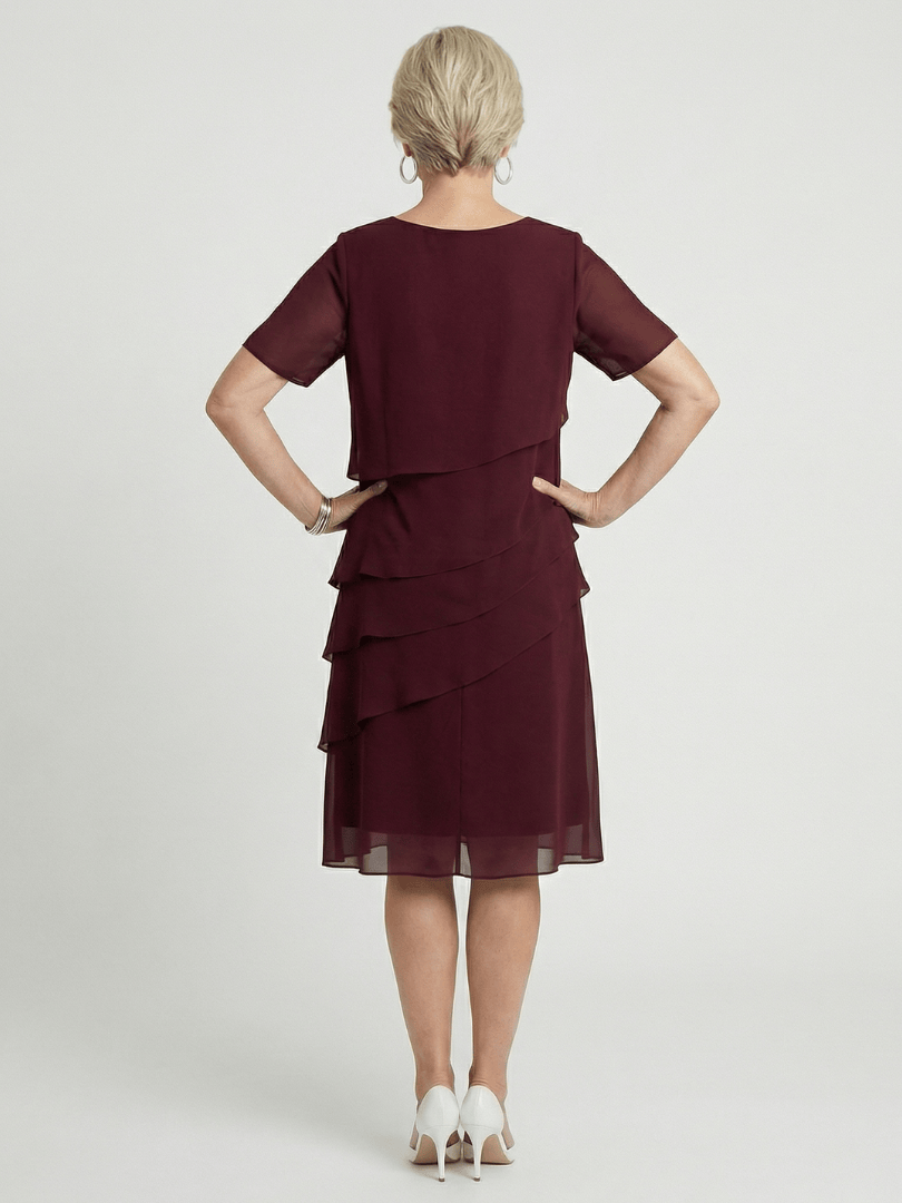 Orson™ contour knee-length dress by Emma & Rose Cape Town, featuring a fitted silhouette and elegant design.