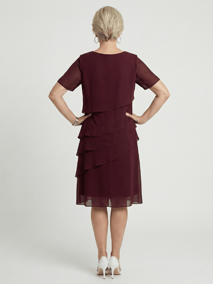 Orson™ contour knee-length dress by Emma & Rose Cape Town, featuring a fitted silhouette and elegant design.