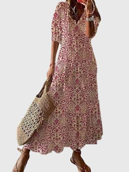 Emma & Rose Cape Town Amalia™ boho vintage summer dress with floral pattern and flowing fabric, perfect for warm weather.