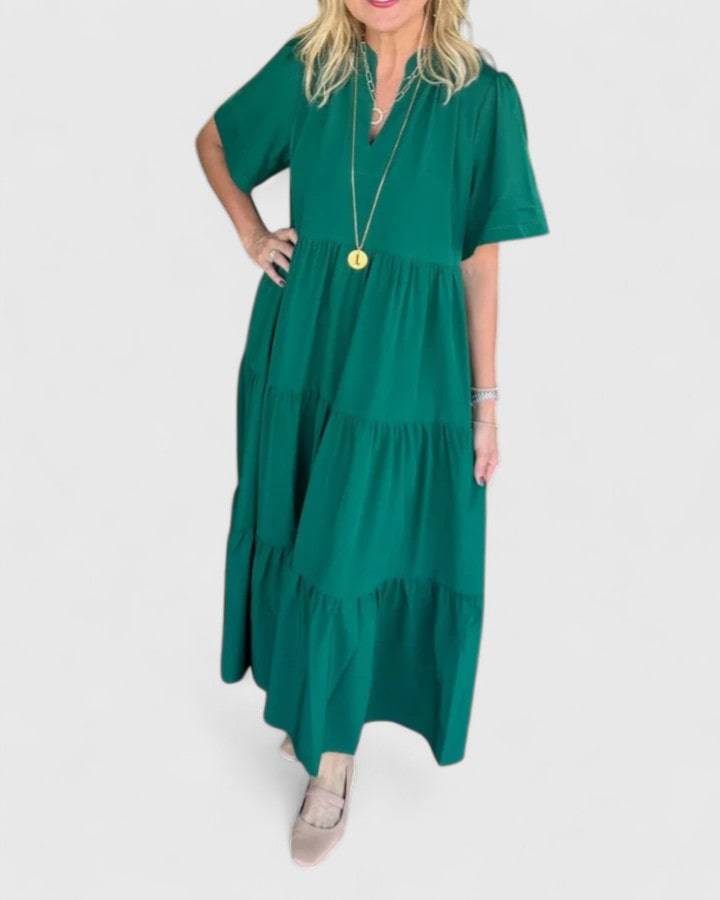 Rebecca™ elegant maxi dress by Emma & Rose Cape Town, flowing fabric and stylish design, shown on a model.