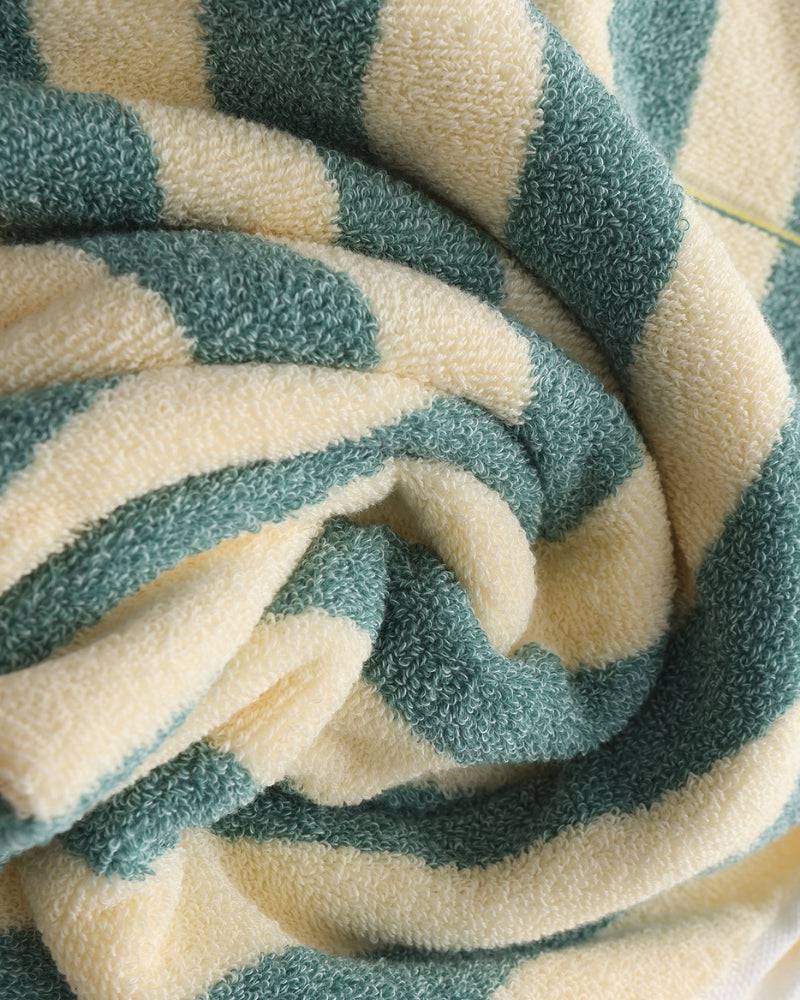 Emma & Rose Manhattan Lance™ Sea Stripe Hand Towel with blue and white nautical pattern, soft cotton fabric, hanging on a towel rack