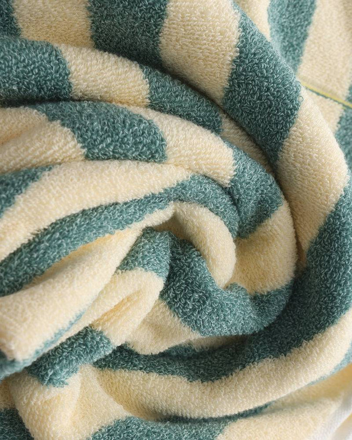 Emma & Rose Manhattan Lance™ Sea Stripe Hand Towel with blue and white nautical pattern, soft cotton fabric, hanging on a towel rack