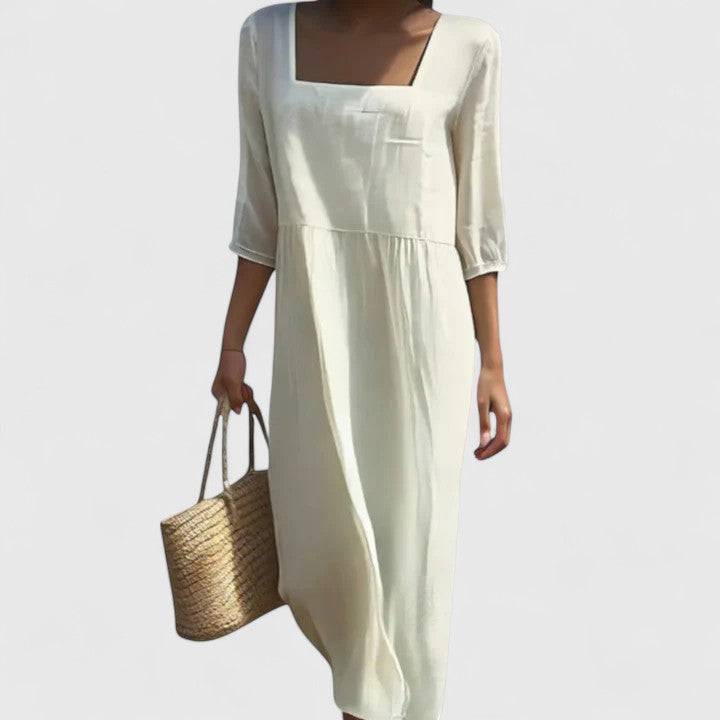 Elegant Delyshann™ dress by Emma & Rose Cape Town featuring a stylish design and flowing fabric, showcased on a mannequin.