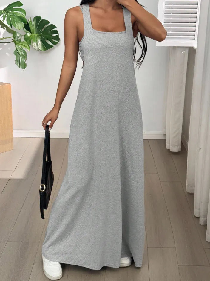Long women's dress with a two-piece effect and side cutouts