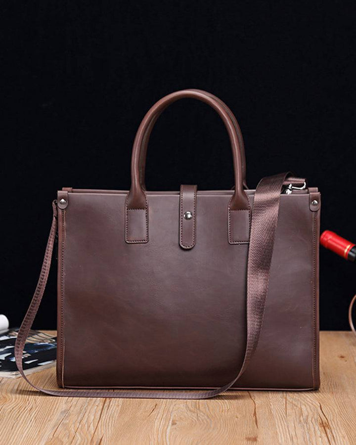Emma & Rose Manhattan Roger™ business case with sleek leather exterior and sturdy handle for professional travel use.