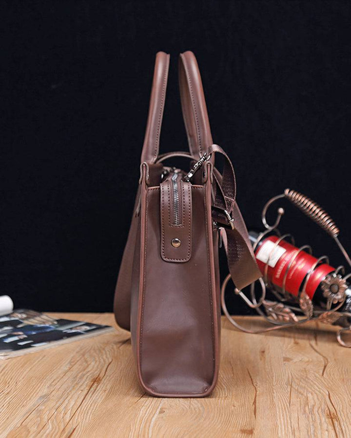 Emma & Rose Manhattan Roger™ business case with leather exterior, handle, and silver hardware for professional carry.