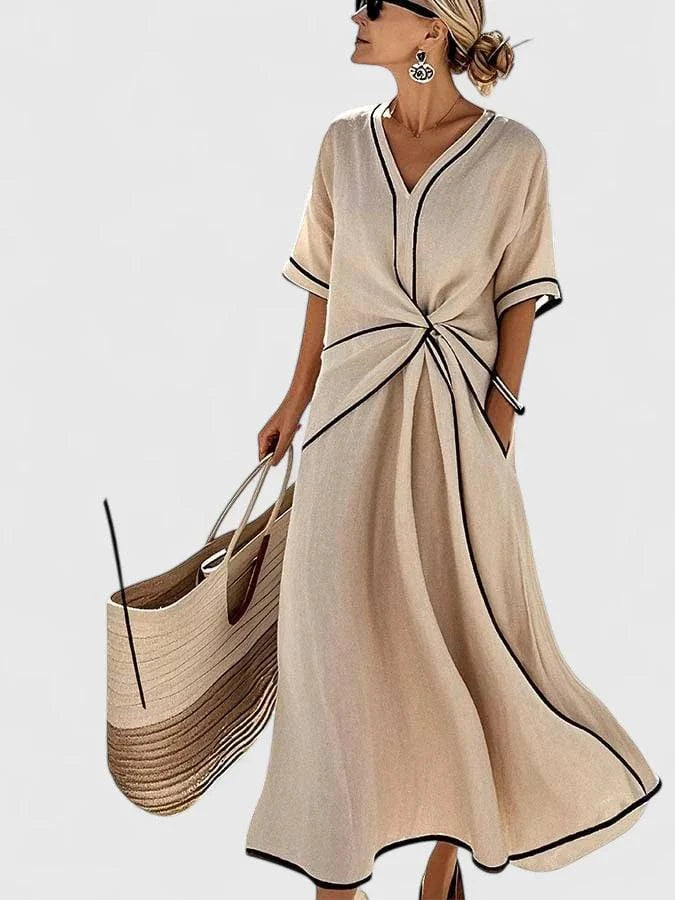Elegant Erykahhh™ dress by Emma & Rose Cape Town featuring a flowing silhouette and stylish design, shown on a model.