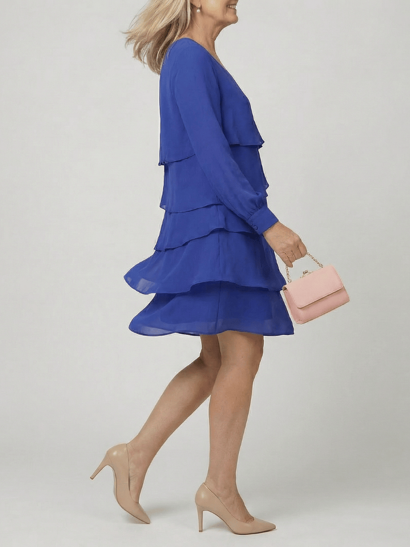 Emma & Rose Cape Town Kirax™ layered knee-length dress featuring a flowing silhouette and elegant design.