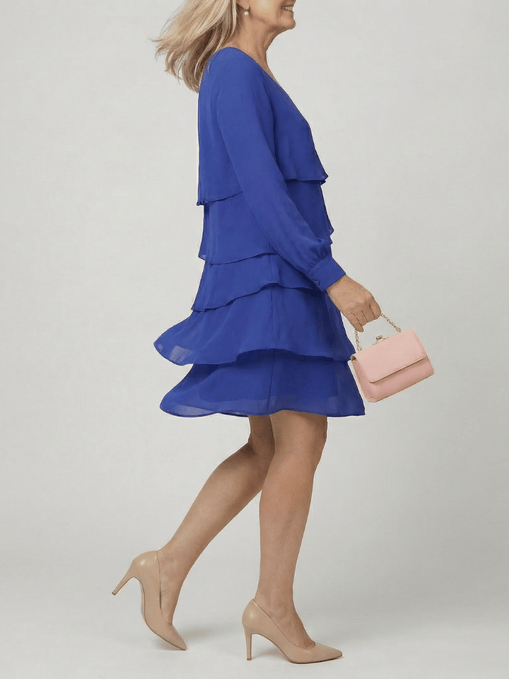 Emma & Rose Cape Town Kirax™ layered knee-length dress featuring a flowing silhouette and elegant design.