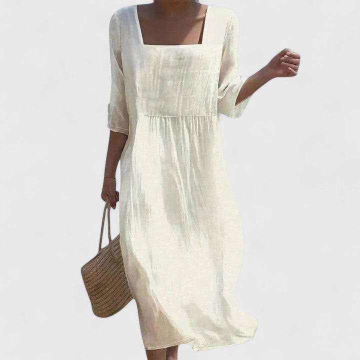 Elegant Delyshann™ dress by Emma & Rose Cape Town, featuring a stylish design, showcased on a mannequin with a neutral background.
