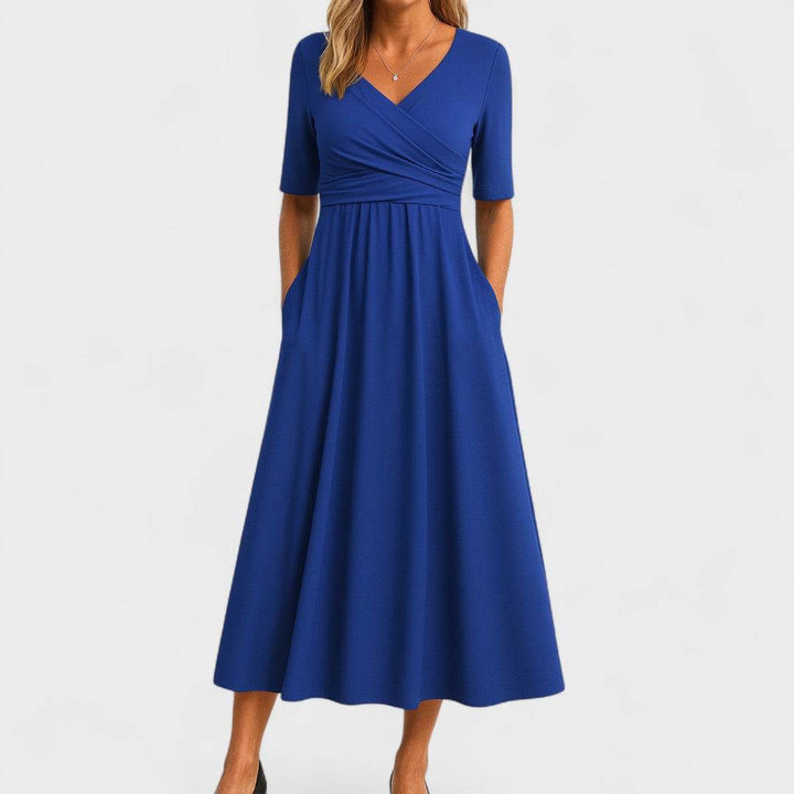 Emma & Rose Cape Town Phoebe™ elegant midi dress in soft fabric, showcasing a fitted waist and flowing skirt.