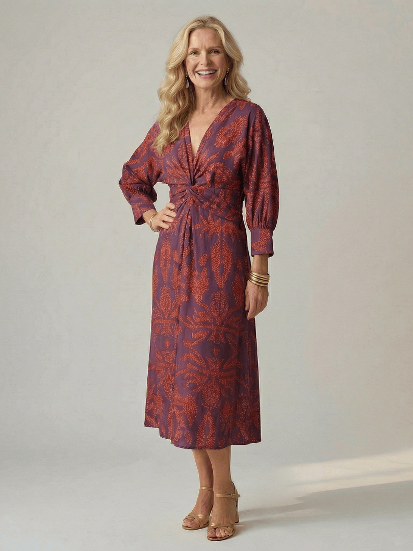 Lune™ Natural Wrap Midi Dress by Emma & Rose Cape Town, featuring flowing fabric and elegant design, displayed on a hanger.