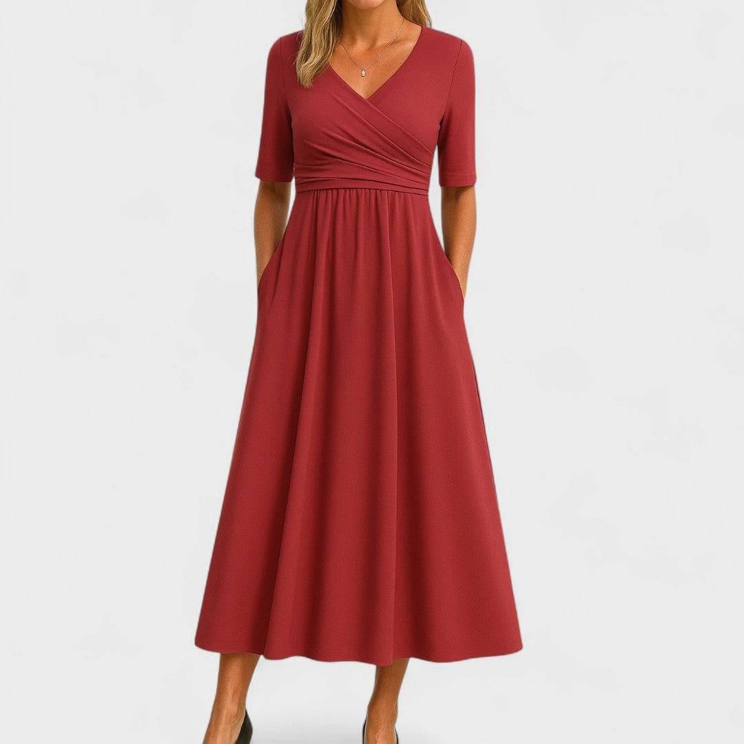Elegant Phoebe™ midi dress by Emma & Rose Cape Town, shown in a stylish, flowing design with intricate detailing.