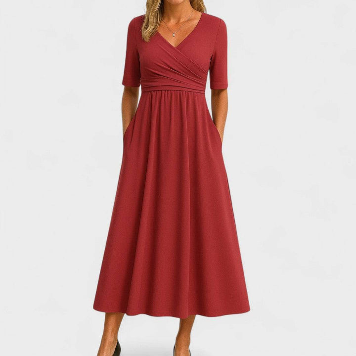Elegant Phoebe™ midi dress by Emma & Rose Cape Town, shown in a stylish, flowing design with intricate detailing.