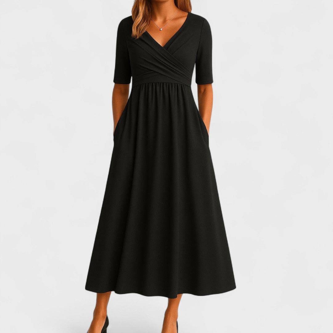 Elegant Phoebe™ midi dress by Emma & Rose Cape Town, featuring a flowing fabric and sophisticated design, shown on a model.