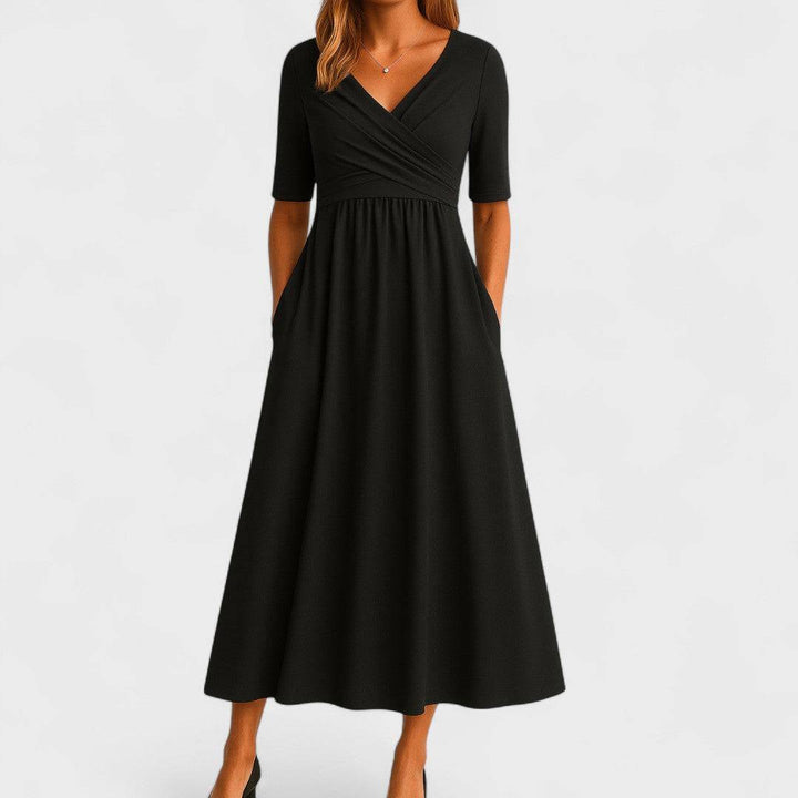 Elegant Phoebe™ midi dress by Emma & Rose Cape Town, featuring a flowing fabric and sophisticated design, shown on a model.