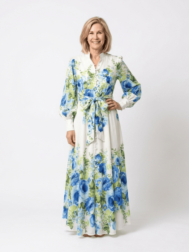 Emma & Rose Cape Town Harper™ button front maxi dress shown in a flowing fabric with a fitted waist and long sleeves.