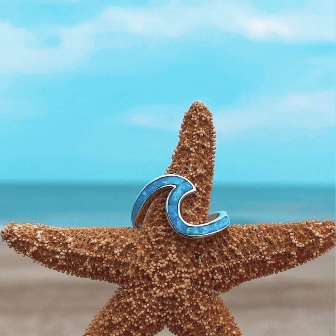 Silver ring with opal and wavy shapes