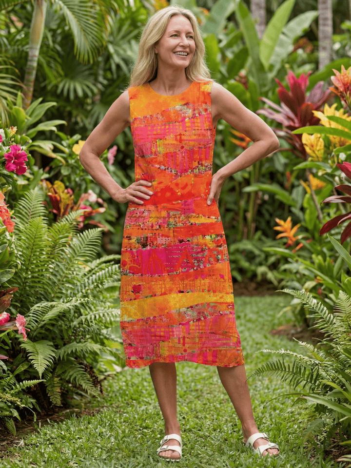Leilani™ Painted Path midi dress by Emma & Rose Cape Town, featuring a floral pattern and flowing fabric, displayed on a hanger.