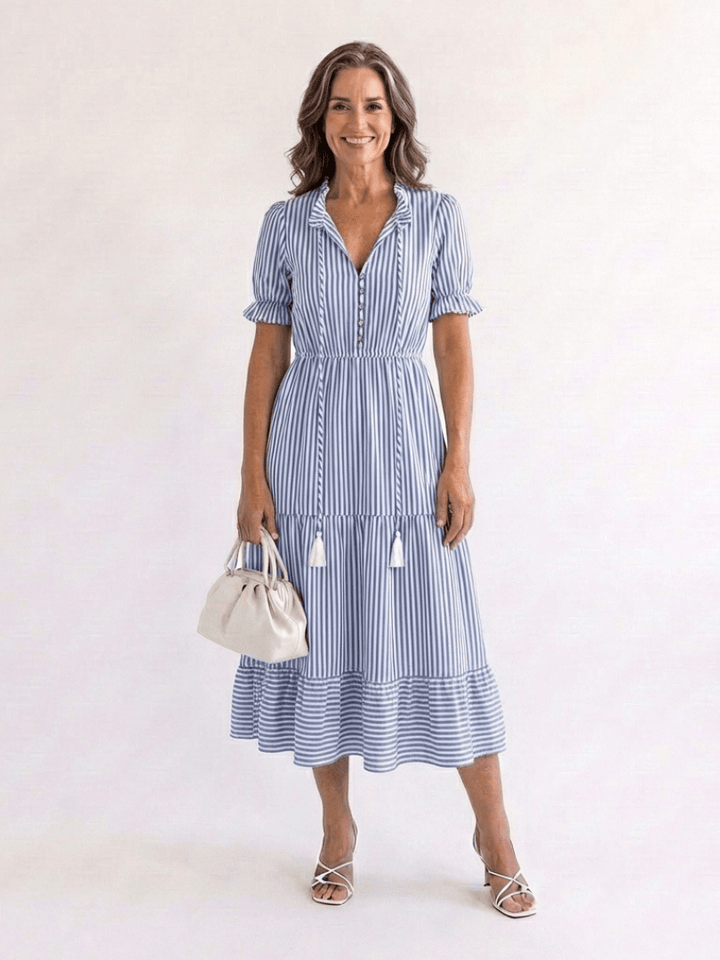 Emma & Rose Cape Town Dakota striped tiered midi dress with ruffled layers and sleeveless design on a model.