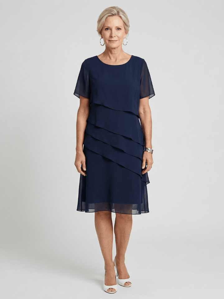 Orson™ Contour knee-length dress by Emma & Rose Cape Town, featuring a fitted silhouette and elegant design.