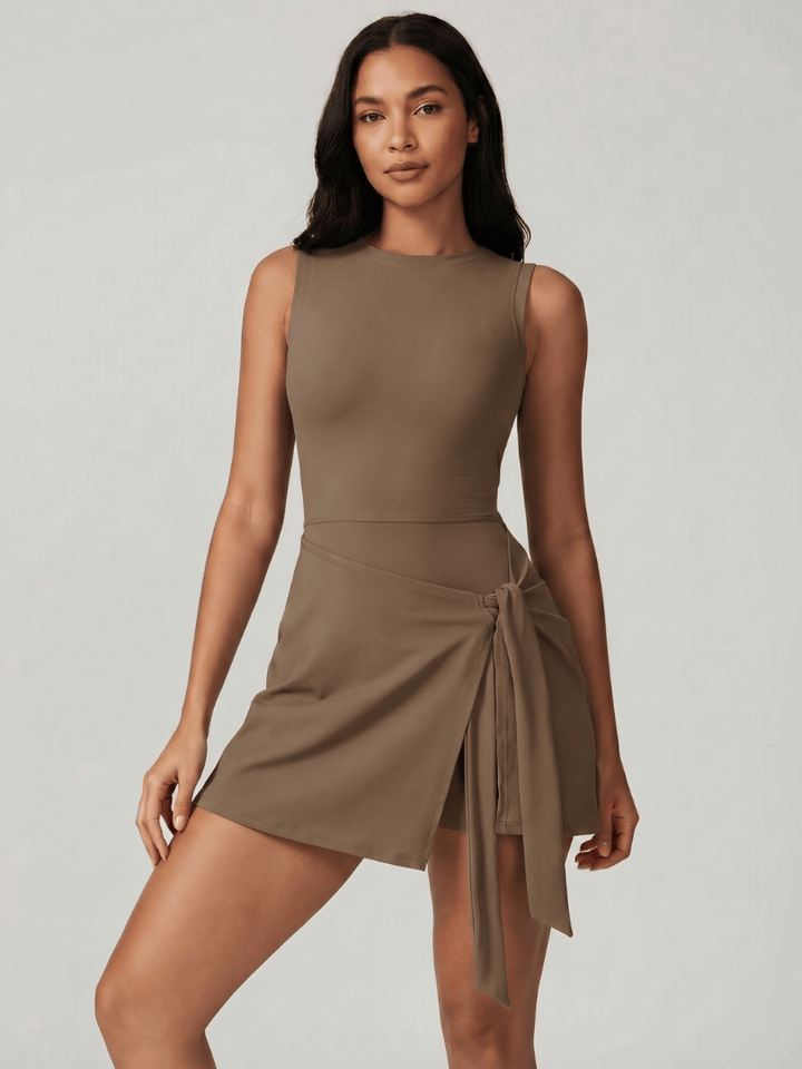 Carys™ sleeveless wrap tennis dress by Emma & Rose Cape Town, showing the fitted athletic dress with wrap detail and sleeveless design.