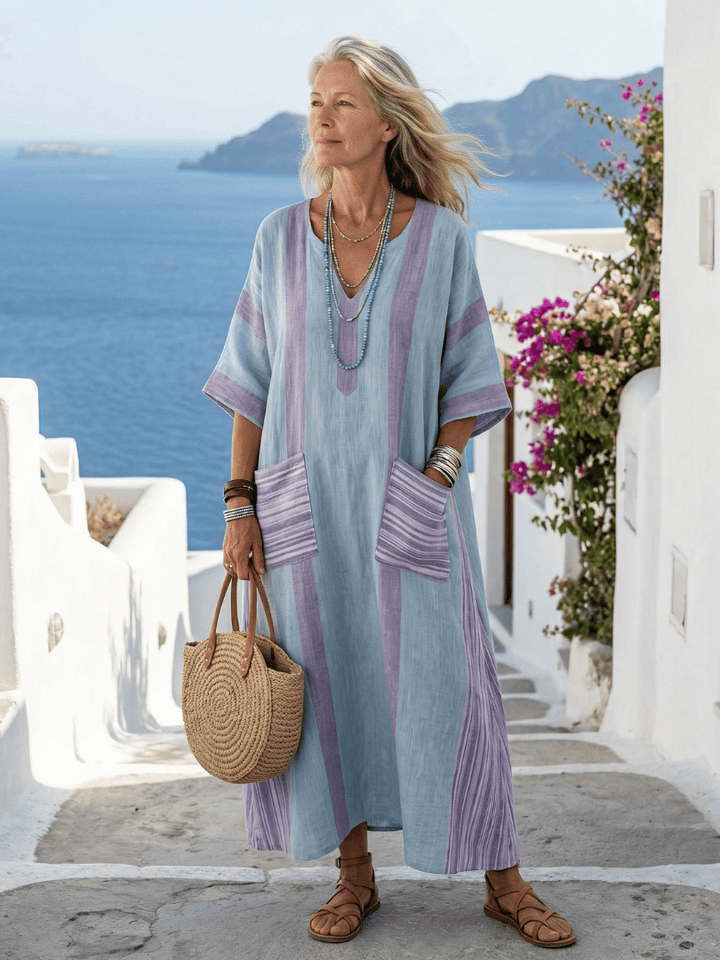 Emma & Rose Cape Town Orien™ Flow Pocket Midi Dress, showing soft fabric, flowy silhouette, and pocket details.