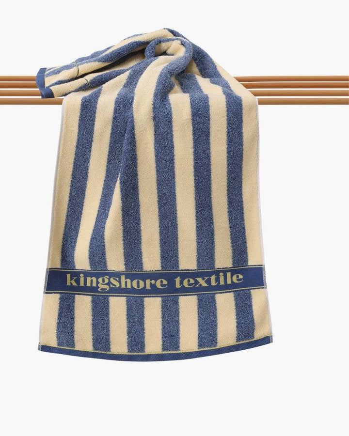 Emma & Rose Manhattan Lance™ Sea Stripe hand towel with blue and white nautical pattern, soft cotton fabric, close-up of textured stripes.