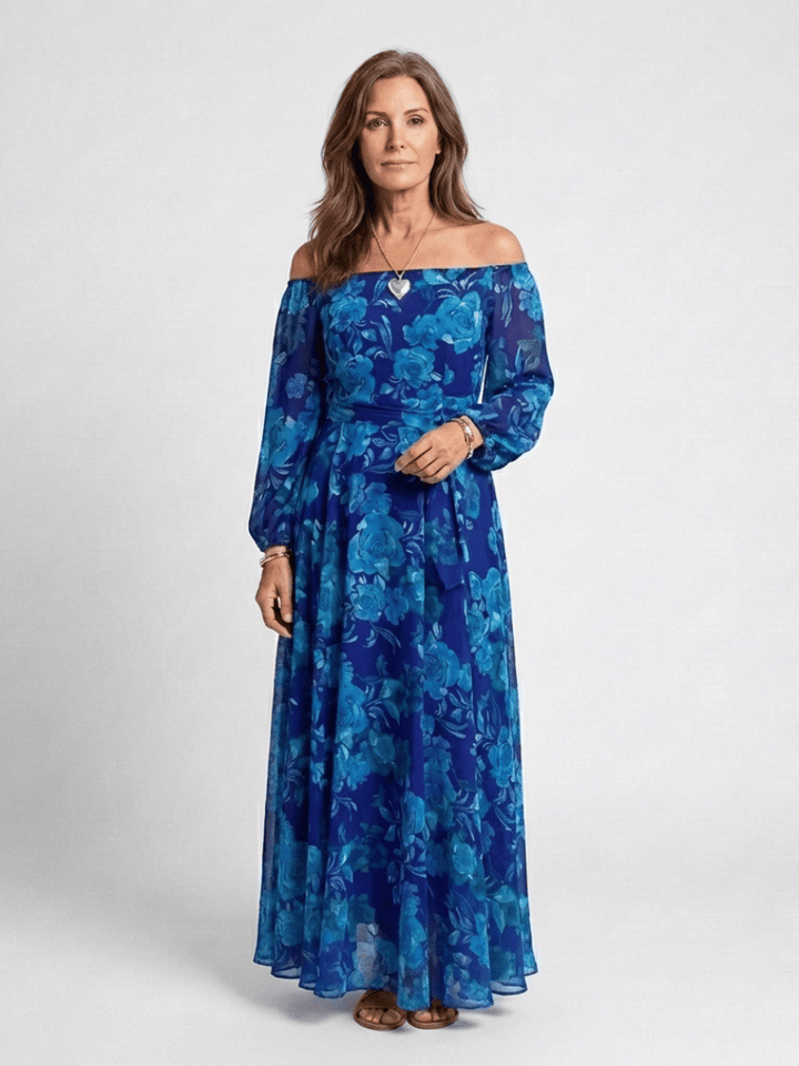 Emma & Rose Cape Town Aspen™ shoulder floral maxi dress with colorful floral pattern and flowing fabric.