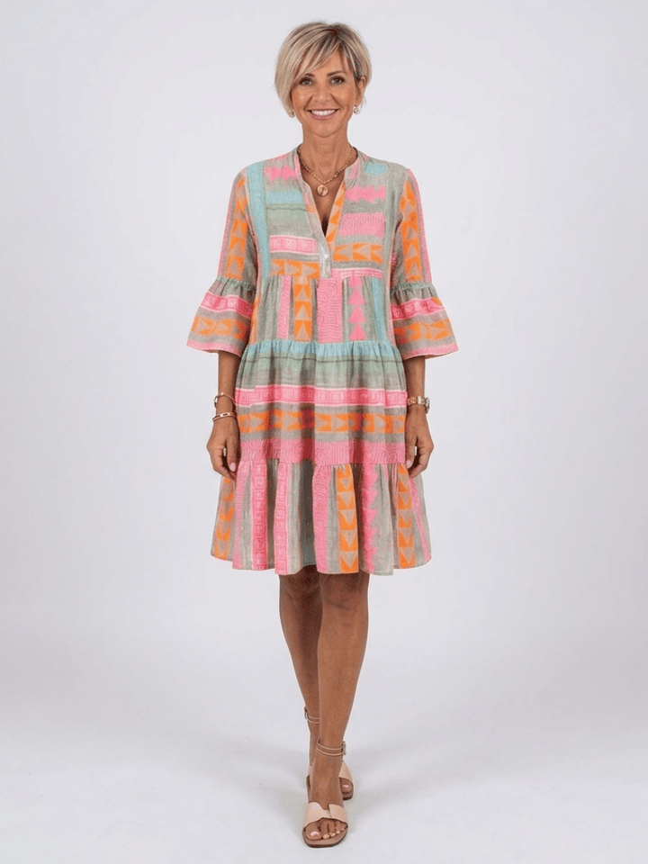 Maelle™ tiered knee-length dress by Emma & Rose Cape Town, featuring a flowing, layered design perfect for casual or semi-formal wear.