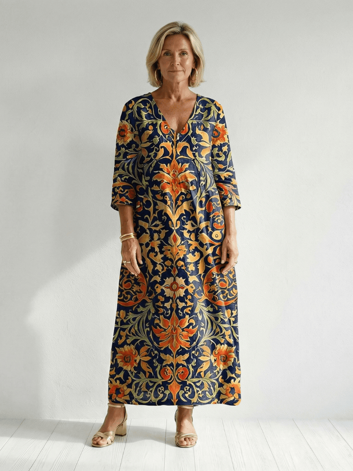Emma & Rose Cape Town Elise™ ornate floral midi dress with intricate embroidery and flowing fabric, perfect for elegant occasions.