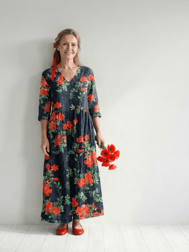 Emma & Rose Cape Town Cyrus™ floral midi dress featuring a flowing drape and vibrant floral pattern.