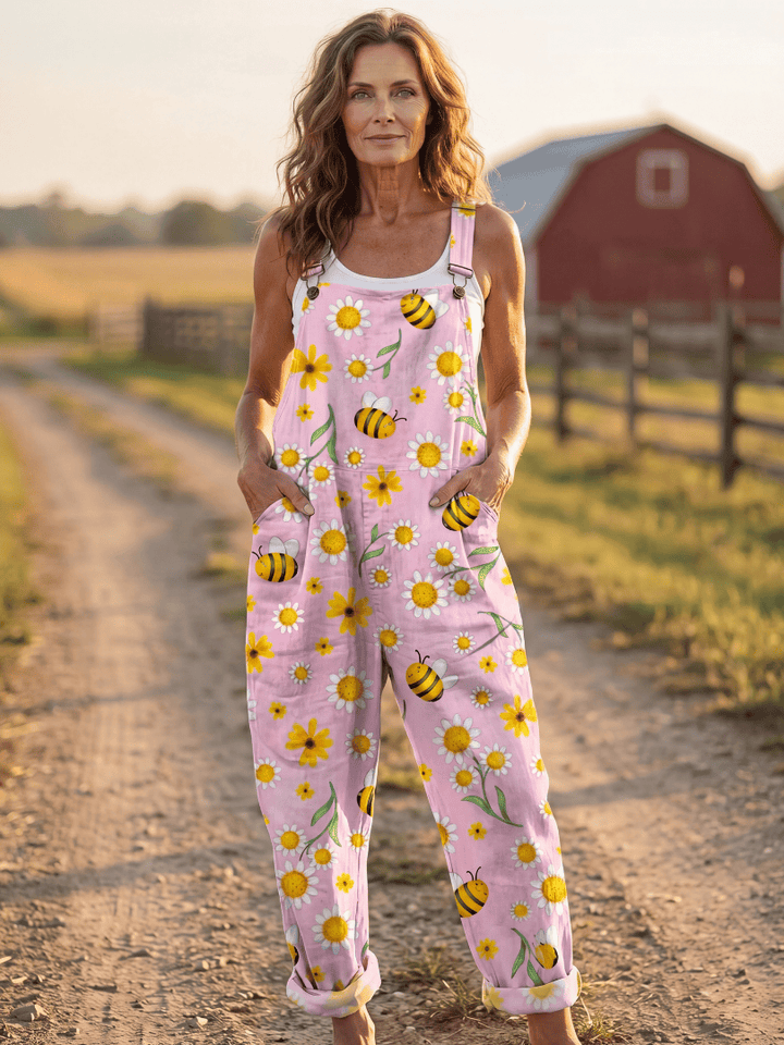 Evangeline™ Bloom Day Jumpsuit by Emma & Rose Cape Town, woman wearing a stylish floral jumpsuit with adjustable straps and wide legs.