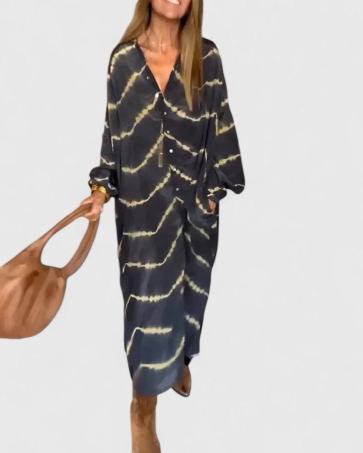 Emma & Rose Cape Town Amelie™ Boho Striped Maxi Dress with flowing fabric and vibrant bohemian pattern.