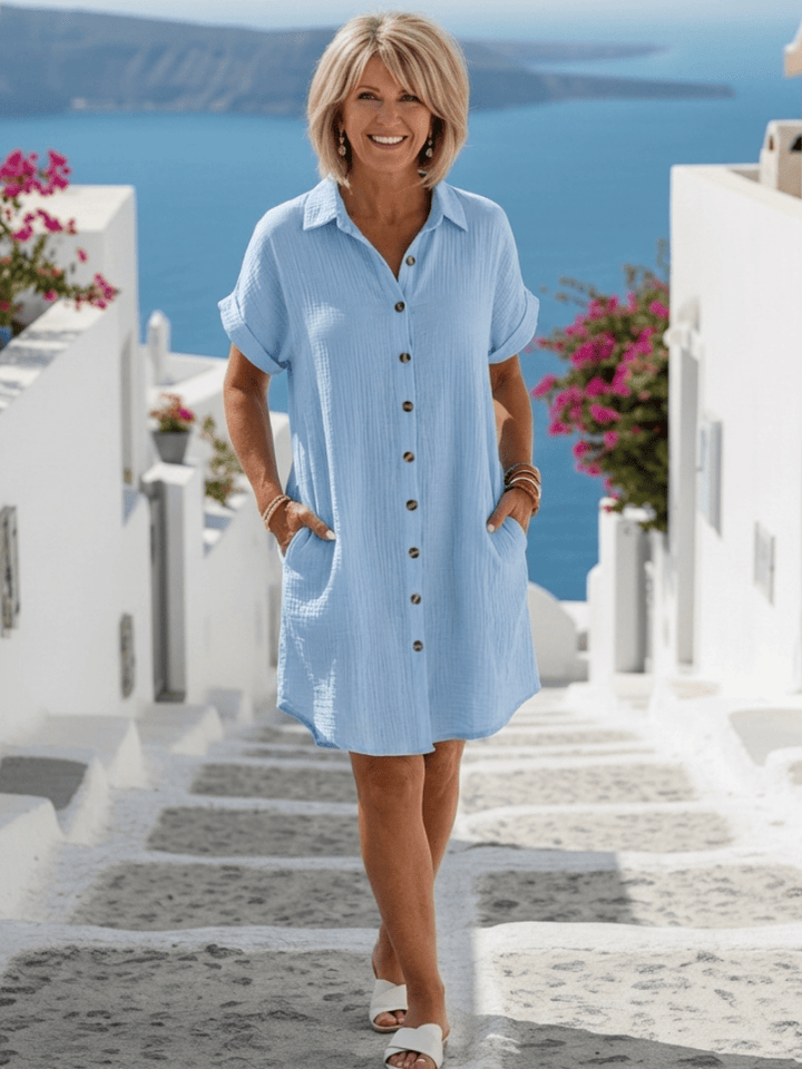 Emma & Rose Cape Town Briseis™ collared short sleeve dress, navy blue with button details, displayed on a mannequin.