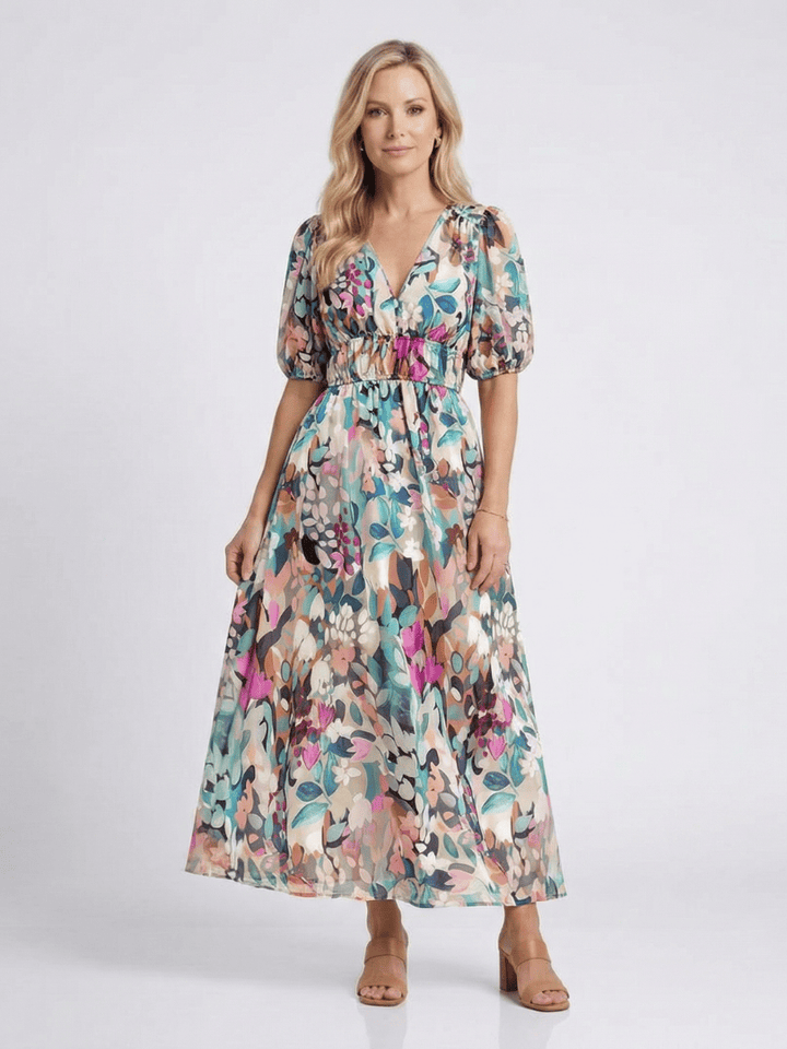Emma & Rose Cape Town Eulalie™ gathered waist midi dress featuring a flowing fabric and elegant design, shown in natural light.