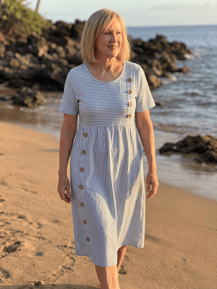 Emma & Rose Cape Town Anela™ Harbor Midi Dress displayed on a hanger with a flowing design and nautical-inspired style.