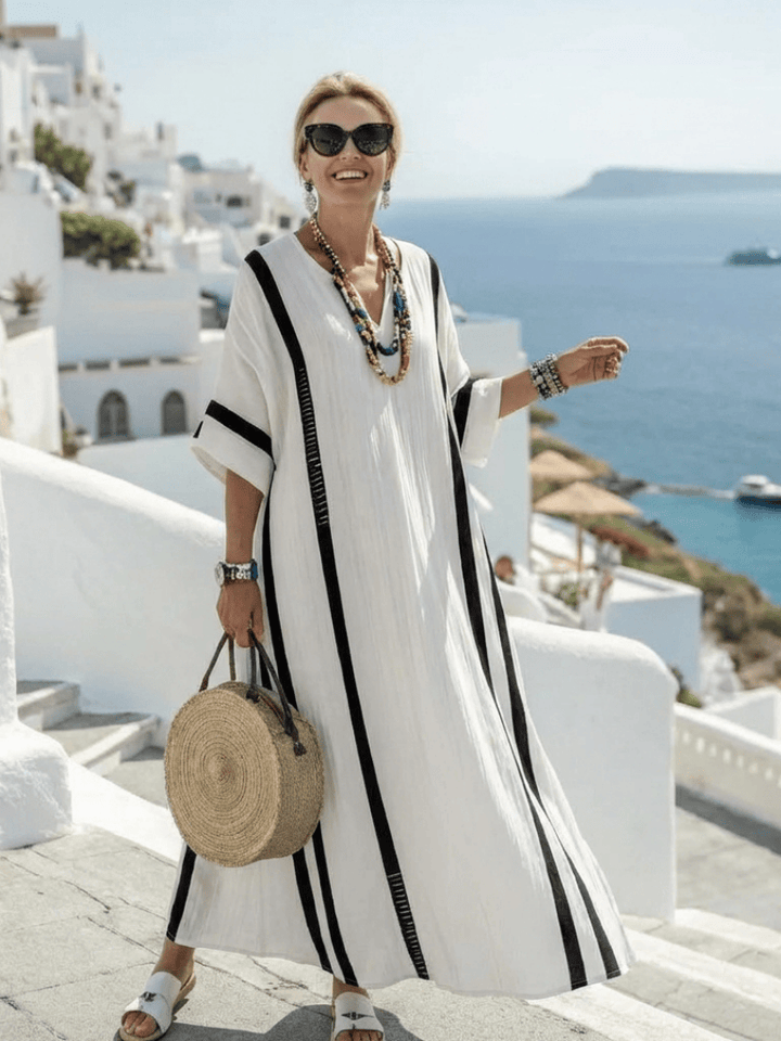 Elvienne™ block striped maxi dress by Emma & Rose Cape Town, featuring a flowing silhouette and bold horizontal stripe pattern.