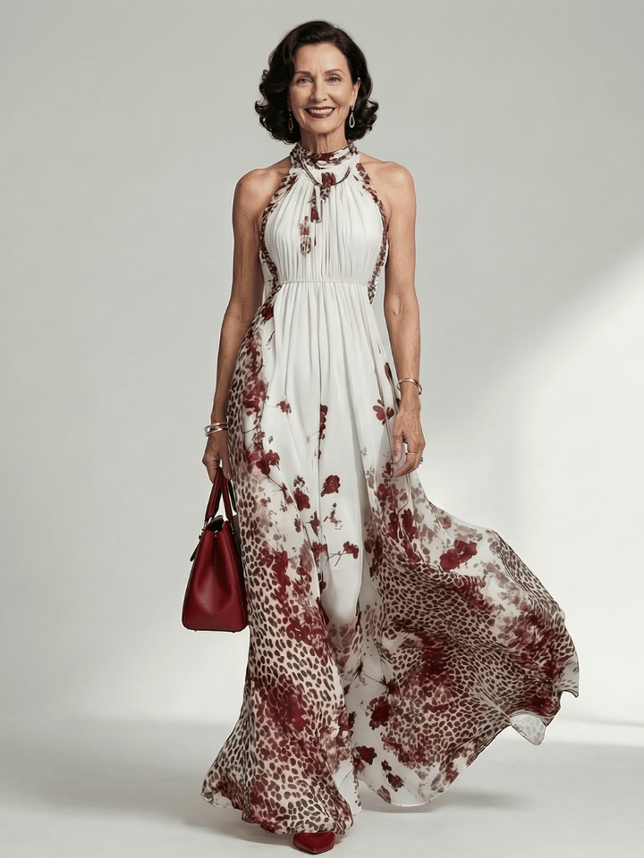 Emma & Rose Cape Town Orlune™ pleated white maxi dress, flowing fabric, high neckline, and full-length design shown in the image.